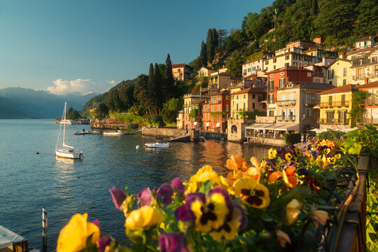 Historic town of Varenna along the shores of famous Lago di Como illuminated in golden evening light at sunset, Lombardy, Italy