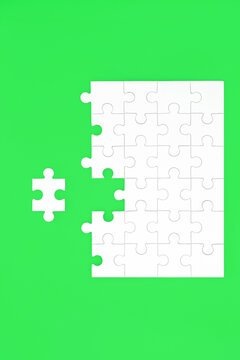 Jigsaw puzzle with missing piece on green background. Opportunities for green issues collaboration on environmental problem solving concept.