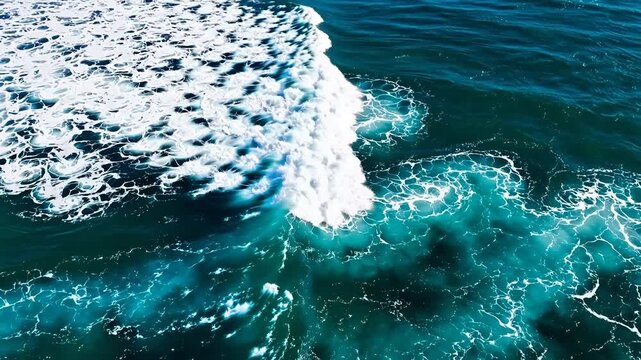 Aerial view of ocean waves and foam