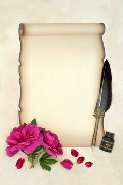 Writing a romantic old fashioned love letter to a lover on faded paper scroll on parchment, quill pen, ink bottle  with red rose flowers. Rosa rugosa. Copy space.