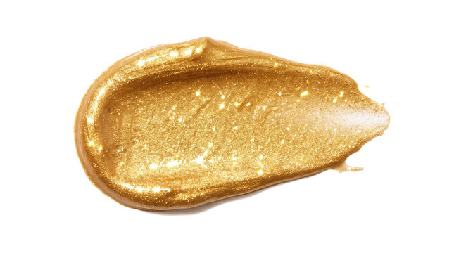 Gold metallic cosmetic smear featuring sparkling glitter particles glowing liquid paint swatch resting flat against pure bright blank isolated professional photography backdrop
