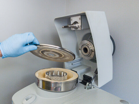 Brussels, Belgium. Opening centrifugal laboratory mill after grinding homogenized cereal sample for DNA analysis