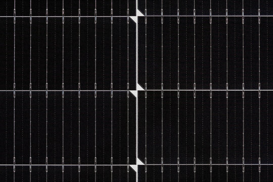 New dark black solar panel background. Closeup. Top down view.