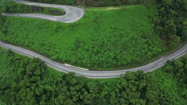 Twisting Roads Of Hai Van Pass Danang Vietnam Dense Green Jungle Drone Track Left 4K 30FPS