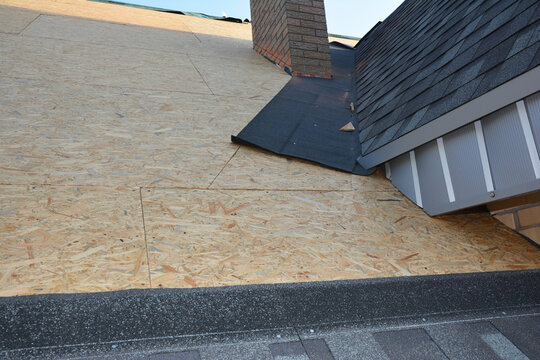 Roof flashing waterproofing around dormer window with asphalt shingles