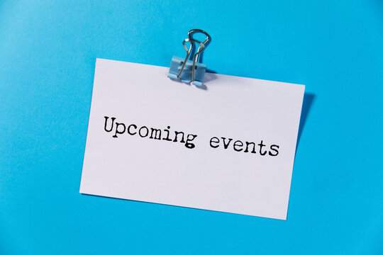 Upcoming events chalkboard sign on wooden desk