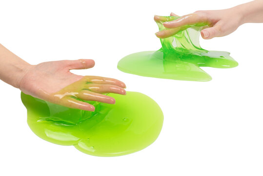 Green slime toy in woman hand isolated on white background.