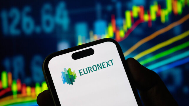 Euronext corporate logo on smartphone screen over abstract financial market data graphics.