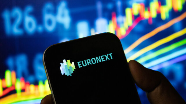 Euronext exchange branding on smartphone screen against colorful financial graph backdrop.