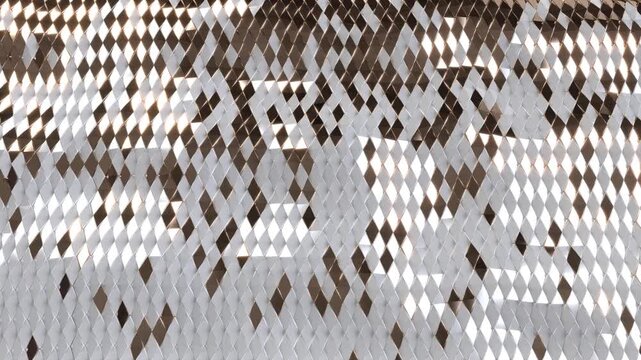 3D render animation of abstract metallic wave surface made of silver and gold diamond shapes. Luxury moving texture background, seamless loop.