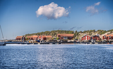Fototapeta premium Scenic Coastal Townscape with Waterfront Houses and Clear Blue Sky Aerial View, Frederikstad, Norway