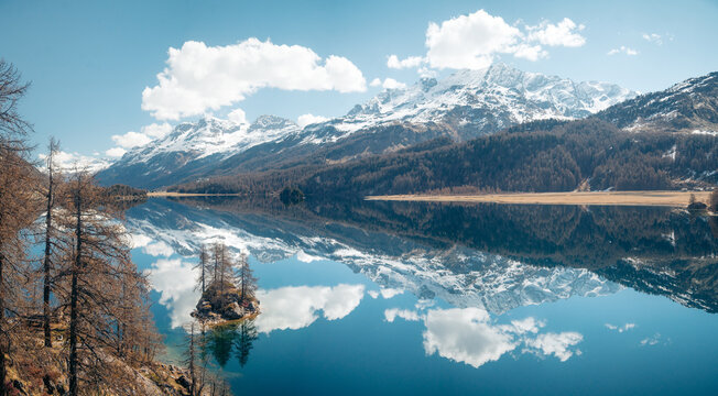 Spectacular Engadin Valley mountain landscape with snow-capped peaks reflecting in calm Silsersee lake, Engadin, Graub&uuml;nden, Switzerland	