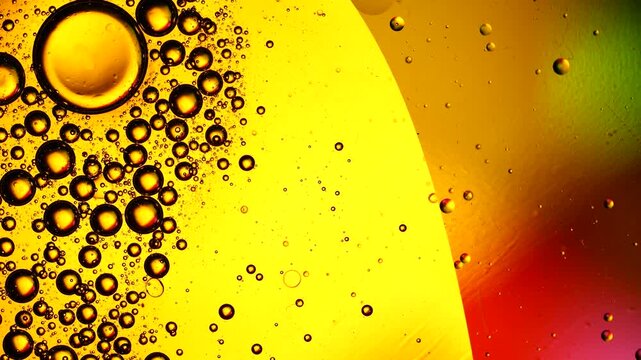 Abstract oil bubbles moving over a colorful liquid background