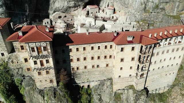 Aerial drone view of Sumela Monastery in summer season, historic Greek Orthodox monastery carved into a cliff in Trabzon, Turkey.