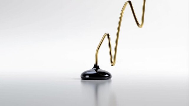 A black droplet falls on a reflective surface, sprouting a golden wire that grows into a sharp zigzag pattern. This minimalist, elegant animation is set against a clean white backdrop.