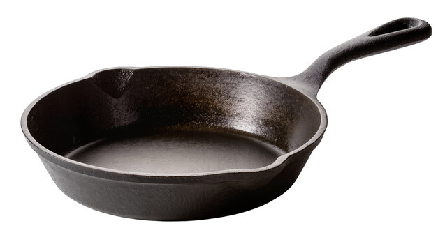 Isolated dark seasoned cast iron skillet, a traditional heavy-duty kitchen cooking tool