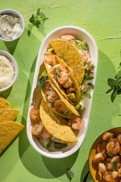 Mexican tacos with shrimp, fresh vegetables and lime