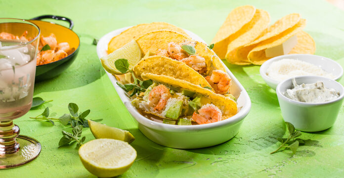 Mexican tacos with shrimp, fresh vegetables and lime