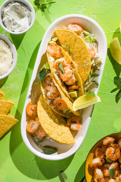 Mexican tacos with shrimp, fresh vegetables and lime