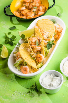 Mexican tacos with shrimp, fresh vegetables and lime