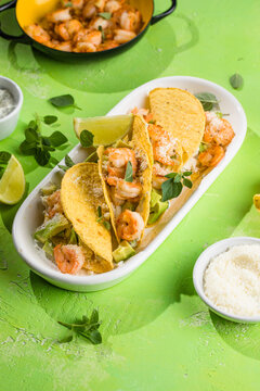 Mexican tacos with shrimp, fresh vegetables and lime