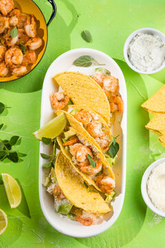 Mexican tacos with shrimp, fresh vegetables and lime