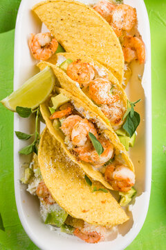 Mexican tacos with shrimp, fresh vegetables and lime