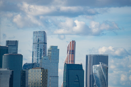 Epic Moscow City international business center skyscrapers vertical panorama. 
Cinematic view of modern futuristic office glass towers district, 
urban financial center facade skyscrapers and green pa
