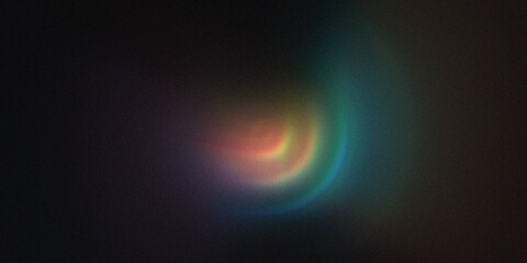 Fototapeta premium Abstract blurred colorful light flare on dark background.
