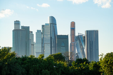 Obraz premium Epic Moscow City international business center skyscrapers landscape panorama. Cinematic horizontal view of modern office glass towers district, urban financial center facade skyscrapers and green p