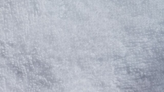 Close-up of soft white cotton textile fabric. Texture of fabric. High quality 4k footage