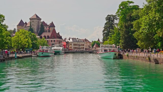 Annecy Castle and Canal with Tourist Boats in Annecy France.Captured on April 29, 2026.