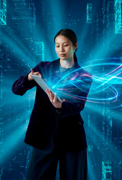 Businesswoman operating digital tablet with futuristic data visualization in virtual technology environment