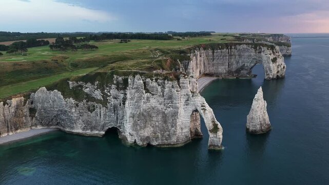 Etretat France chalk cliffs natural arches and sea stack at daylight