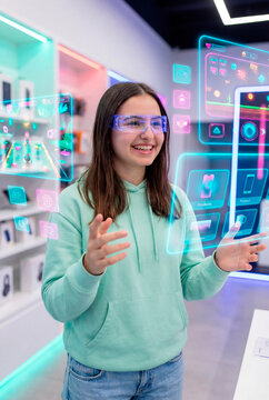 Teenage girl comparing smart devices with an augmented reality product showcase interface