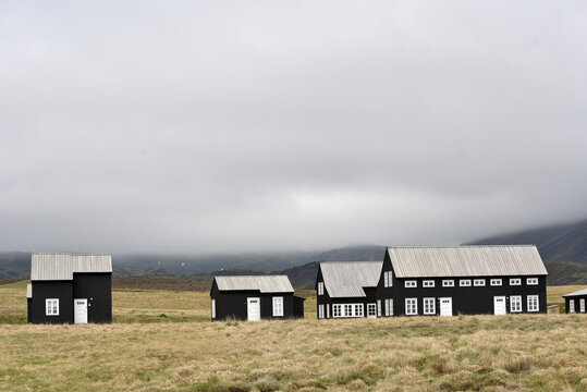 Black wooden houses in Hellnar village, Iceland