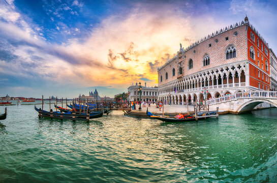 Amazing landscape of Riva degli Schiavoni with parked gondolas in Venice.