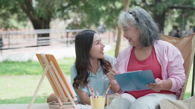 Artistic Bonds: A grandmother and granddaughter share a heartwarming moment of artistic exploration.