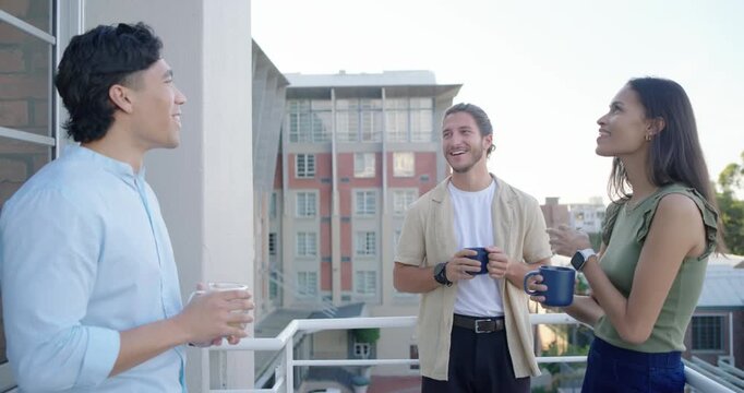 Diverse friends catching up on balcony, left person starting chat while others sipping blue mugs