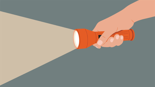 Human hand holding an orange flashlight and shining a bright beam of light into the dark space on a gray background.