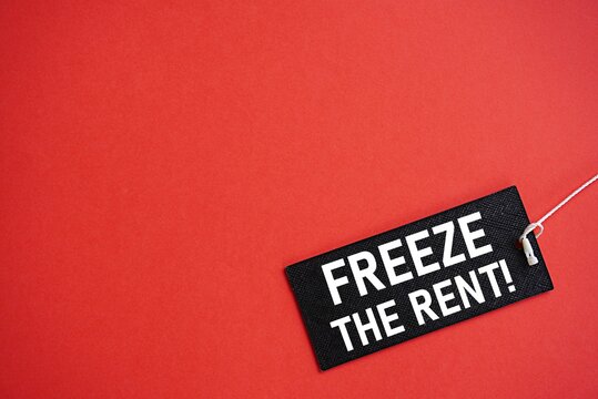 FREEZE THE RENT printed black card. Financial concept. Real estate rental business. Rent increase. Maintain rent. Blank background for text. Background for writing and pictures. For various uses