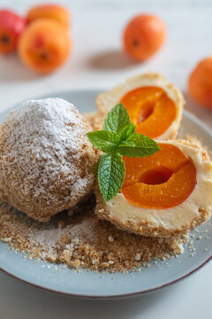 Sweet potato dumplings filled with apricots on a plate