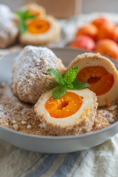 Sweet potato dumplings filled with apricots on a plate