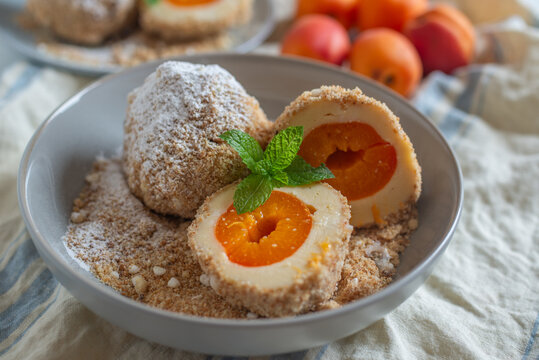 Sweet potato dumplings filled with apricots on a plate