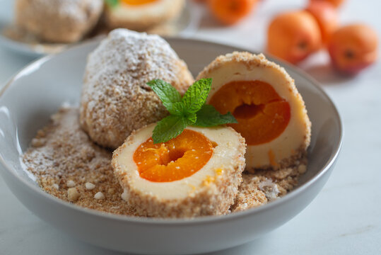 Sweet potato dumplings filled with apricots on a plate