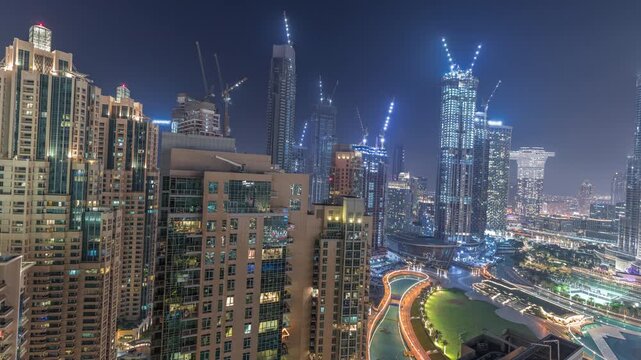 Downtown Dubai panorama high angle night timelapse filmed across Dubai. The extreme vertical density of the urban center is highlighted by artificial lighting. Unique design.
