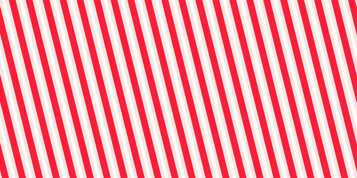 Red and pink Christmas seamless pattern. Candy cane diagonal stripes background. Repeating decoration wallpaper. Winter holidays lines backdrop. Xmas peppermint present wrapping print design. Vector
