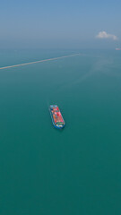 Fototapeta premium Aerial view from a container drone. Container ships in export-import and logistics business Transporting goods to large ports Worldwide shipping and logistics business International business abroad