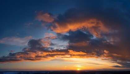 Fototapeta premium A Background Image Of An Orange Blue Sky With Dark Clouds At Sunset On A Winter Evening Beautiful Gentle Sunset