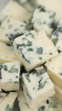 Sliced blue cheeses with a noble mold, rotation